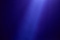 Dark blue background diagonally crosses a blue ray of light Royalty Free Stock Photo