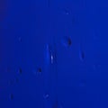 Dark blue background with a drop of liquid