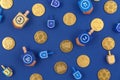 Dark blue background with multicolor dreidels and chocolate coin Royalty Free Stock Photo