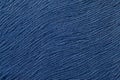 Dark blue background from soft textile material. Fabric with natural texture. Royalty Free Stock Photo