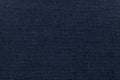 Dark blue background from a textile material. Fabric with natural texture. Backdrop. Royalty Free Stock Photo