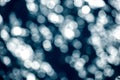 Dark Blue bokeh background. De-focused Abstract Light Circles, sea christmas background with blur bokeh light effect Royalty Free Stock Photo