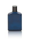 Dark blue Bottle of Perfume isolated on white background with reflection and clipping path. Royalty Free Stock Photo