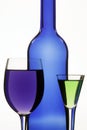 Dark blue bottle and two wine-glasses Royalty Free Stock Photo