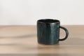 A dark blue ceramic mug Royalty Free Stock Photo