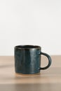 A dark blue ceramic mug Royalty Free Stock Photo