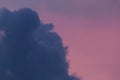 Dark blue cloud against the pink evening sky after the rain nature color background Royalty Free Stock Photo