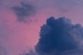 Dark blue cloud against the pink evening sky after the rain nature color background Royalty Free Stock Photo