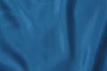 Dark blue colored Background of soft draped fabric