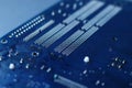 Dark blue computer motherboard closeup in tilt shift style. Selective focus, defocused Royalty Free Stock Photo