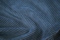 Dark blue corduroy surface texture. Elegant background with space for design. Natural cotton ribbed fabric. Royalty Free Stock Photo