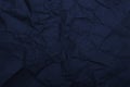 Dark blue crumpled rough paper making a background