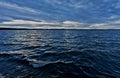 Dark blue evening cloudy sky over the lake Royalty Free Stock Photo