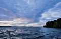 Dark blue evening cloudy watercolor sky over the lake Royalty Free Stock Photo