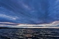 Dark blue evening cloudy watercolor sky over the lake Royalty Free Stock Photo