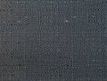 Dark blue fabric background with spots. The texture of the fabric in the perpendicular lines