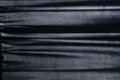 Dark blue fabric with folds as a background Royalty Free Stock Photo