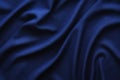 Dark blue fabric with large folds, textile background Royalty Free Stock Photo