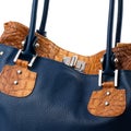 Dark blue female handbag isolated on white background. Royalty Free Stock Photo