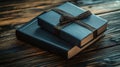 Dark blue gift box atop a book on wood Royalty Free Stock Photo