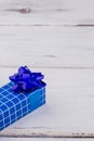 Dark blue gift box on wooden background. Royalty Free Stock Photo