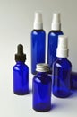 Dark blue glass bottles for cosmetic lotions, serums, oils