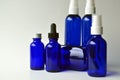 Dark blue glass bottles for cosmetic lotions, serums, oils