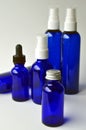 Dark blue glass bottles for cosmetic lotions, serums, oils Royalty Free Stock Photo