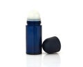 Dark blue glass roll-on deodorant bottle for men and women isolated over white background Royalty Free Stock Photo