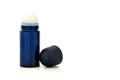 Dark blue glass roll-on deodorant bottle for men and women isolated on white background, copy space Royalty Free Stock Photo