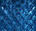 Dark blue glass texture with a pattern of rhombuses. Clear glass diamond shape. Crystals