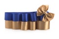 Dark blue and gold satin ribbons and bows on a white background for gift wrapping Royalty Free Stock Photo