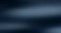 Dark blue and grey abstract blurred background with smooth horizontal gradient and soft light diffusion for a moody Royalty Free Stock Photo