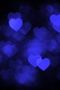 Dark blue heart bokeh background photo, abstract holiday backdrop Royalty Free Stock Photo