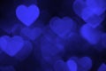 Dark blue heart bokeh background photo, abstract holiday backdrop Royalty Free Stock Photo