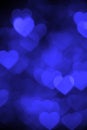 Dark blue heart bokeh background photo, abstract holiday backdrop Royalty Free Stock Photo