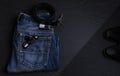 Dark blue jeans with a black leather belt and a pair of black shoes Royalty Free Stock Photo