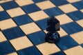 Dark blue knight on wooden chessboard Royalty Free Stock Photo