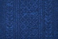 Dark blue sweater knit textured background.