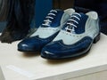 Dark blue men`s leather shoes in a shop window. Men`s fashion shoes, casual design Royalty Free Stock Photo