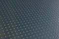 Dark blue metallic background or wallpaper. Abstract aluminum surface with many notch spots. Their ranks go into the distance and