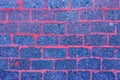 Dark blue and purple old slag brick wall rough texture weathered background Royalty Free Stock Photo