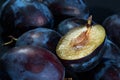 Dark blue ripe fleshy plums