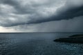 Dark blue sea storm, huge clouds and breakwaters. Royalty Free Stock Photo