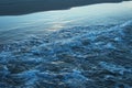 Dark blue sea wave and sea foam close-up Royalty Free Stock Photo