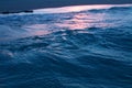 Dark blue sea wave and sea foam close-up