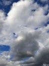Dark blue sky with big clouds.  Immensity, space.  Perfect as a mobile wallpaper. Royalty Free Stock Photo