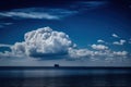 a dark blue sky with a single cloud floating in the distance Royalty Free Stock Photo