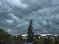 Dark blue stormy sky under households. Background Royalty Free Stock Photo