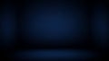 Dark Blue Studio Background with Subtle Gradient and Soft Spotlight Effect on the Floor Keywords: studio, background Royalty Free Stock Photo